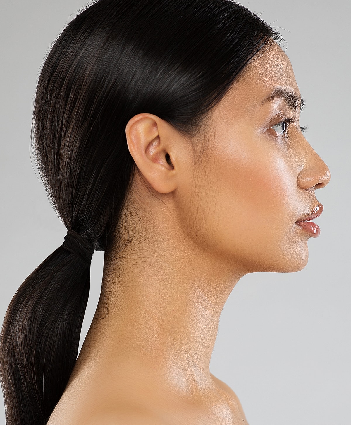 Profile view of a person with long hair.